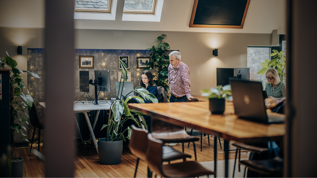 3 people in a co-working space